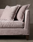 Close detail of the heathered chenille weave on the compressed bench cushion with slumped back pillows
