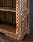 Paneled bookcase side and shaped plinth base.