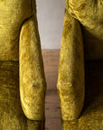Chartreuse velvet diamond-tufted armchair, overhead macro looking down both arm rails