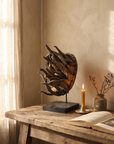 Senufo sacrifice mask styled on a weathered oak table in warm afternoon light