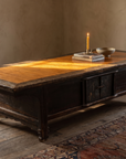 Antique Chinese low table with honey bamboo top, styled in a warm room