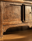 Detail of the central cabinet, metal ring pull, apron and cloud-form foot