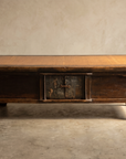 Straight-on studio view of the antique low table
