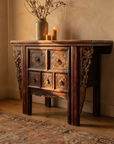 Three-quarter view of the carved console closed