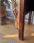 Detail of the pierced floral corner spandrel and leg