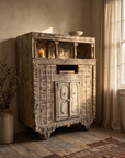 Antique carved cabinet, alternate hero angle in warm light