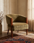 Three-quarter view of the olive velvet club tub chair with cherry wood arms and legs