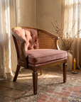 Dusty rose velvet cane barrel chair, three-quarter front view