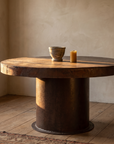 Boiler Table, round reclaimed cast iron table in a warm plaster room