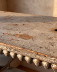 Antique spool table, worn painted top detail