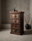 The Sienna Chest, alternate front three-quarter angle in the greige plaster room