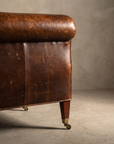 Construction detail of tapered leg and brass castor