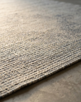 Macro detail of the heathered flatweave texture