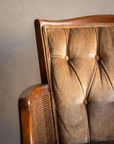 Macro detail of the diamond button tufting and cane side panel weave
