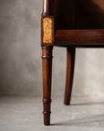 Macro detail of the reeded leg turning and burl wood inset panel, alternate angle