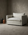 Chair and a half in white, three-quarter angle showing arm and back cushion construction