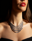 Model wearing Garnet and Peridot Scroll Necklace