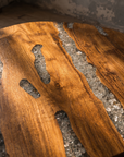 Close-up detail of the Creeklight Parlor Table wood grain and crushed glass river inlay