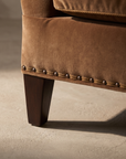 Detail of the tapered leg and bronze nailhead trim on the Taylor King sofa