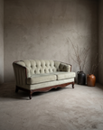 Sage diamond-tufted loveseat, angled three-quarter view showing channel-tufted side wing and cabriole legs