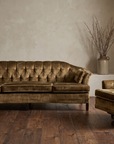 Olive velvet vintage sofa paired with its matching swivel armchair