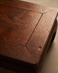 Close-up of the Medium Kang Table's mitered top corner and wood grain