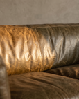 Second macro detail of the cognac leather grain and center seam