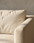 Detail of the linen weave and square track arm of the sofa