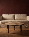 Antique round coffee table, lighter, paired with the RH linen sofa