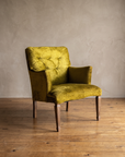 Chartreuse velvet diamond-tufted vintage armchair, clean three-quarter product view