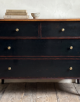 Atelier de Madeleine chest styled lightly with a stack of books and a small ceramic bowl