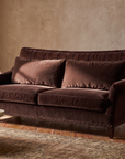 Taylor King espresso brown velvet sofa styled in a warm Organic Erotic living room with plaster walls and reclaimed wood floor