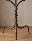 Detail of the rope-twisted wrought iron column with hammered collar bands