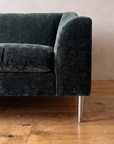 Detail of the right arm and brushed nickel leg