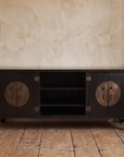 Front view of the black lacquer Chinese TV console showing two cabinets and open center shelves