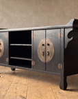 Three-quarter view of the black lacquer console from the right end
