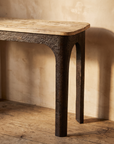 Forge console top and arched iron leg detail