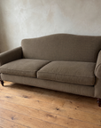 The Marcel camelback sofa, three-quarter view from the left