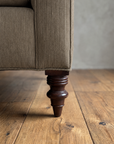 Detail of the turned mahogany leg and corner welt