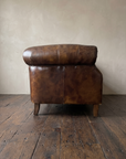 Side profile of the vintage leather chesterfield loveseat