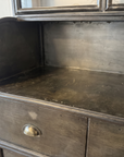 Detail of the curved steel side panel and the counter's honest wear