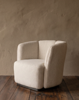 Ford armchair side profile with curved back segments and recessed dark base