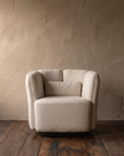 Single white Ford armchair front view showing the three-part petal back and lumbar cushion