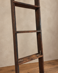 Detail of worn wooden rungs and small metal reinforcement brackets