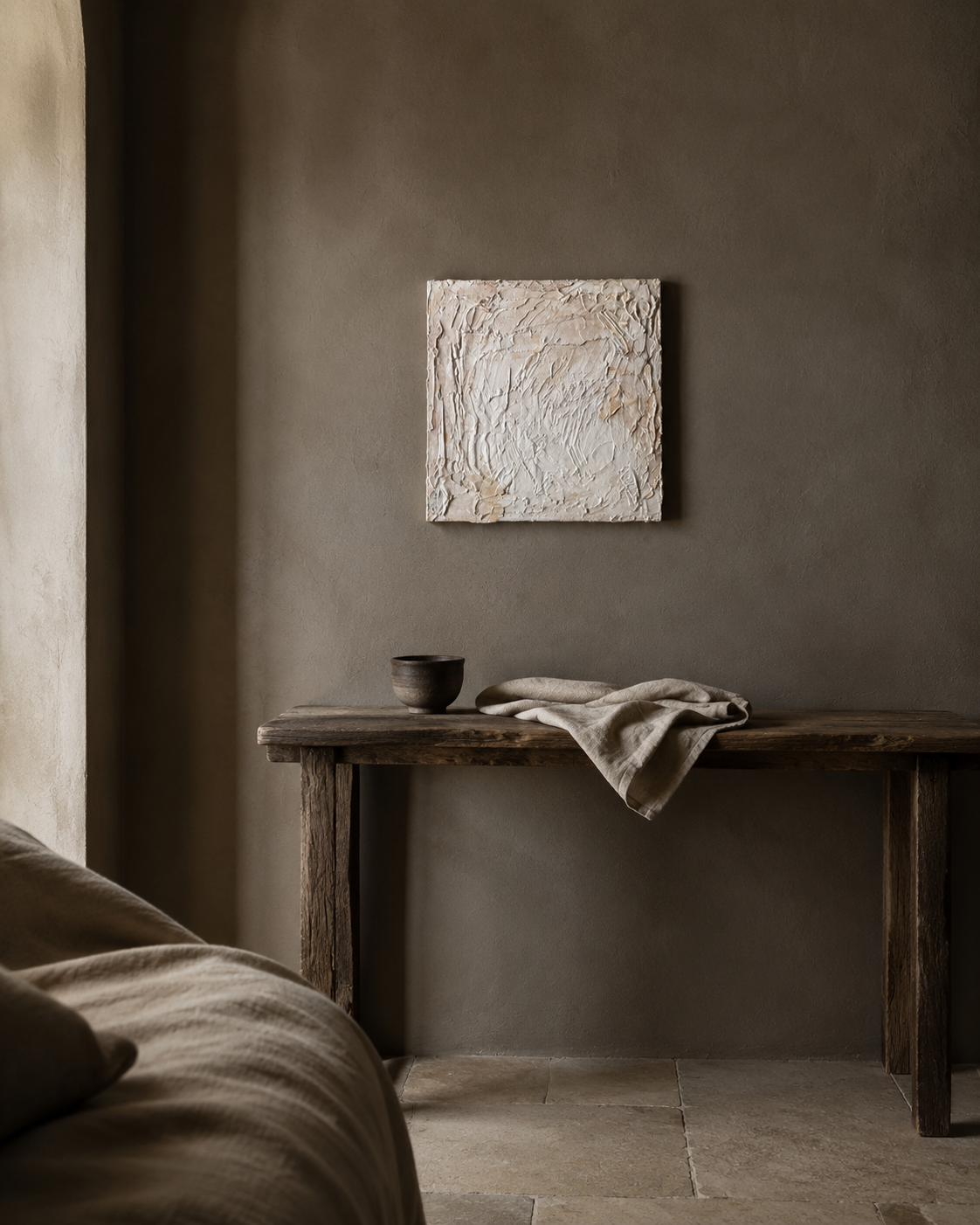 Sanctuary 4 hung above a weathered console in a warm plaster room