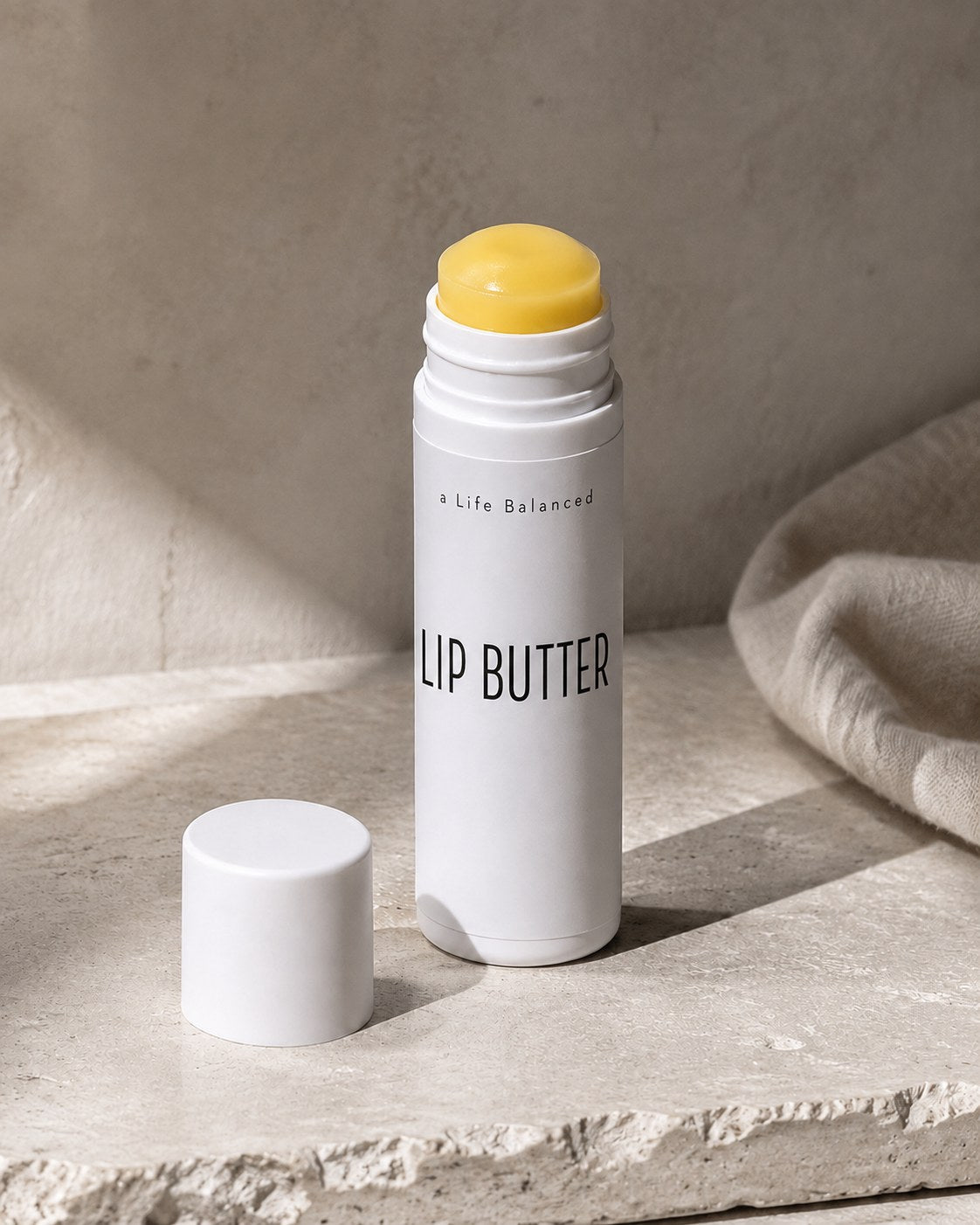 Lip Butter by a Life Balanced in a white twist tube