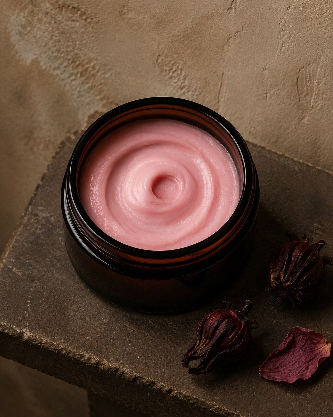 Sorrel Rose whipped body butter in an amber jar with dried hibiscus