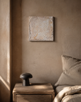 Sanctuary 3 hung above a nightstand in a warm plaster bedroom