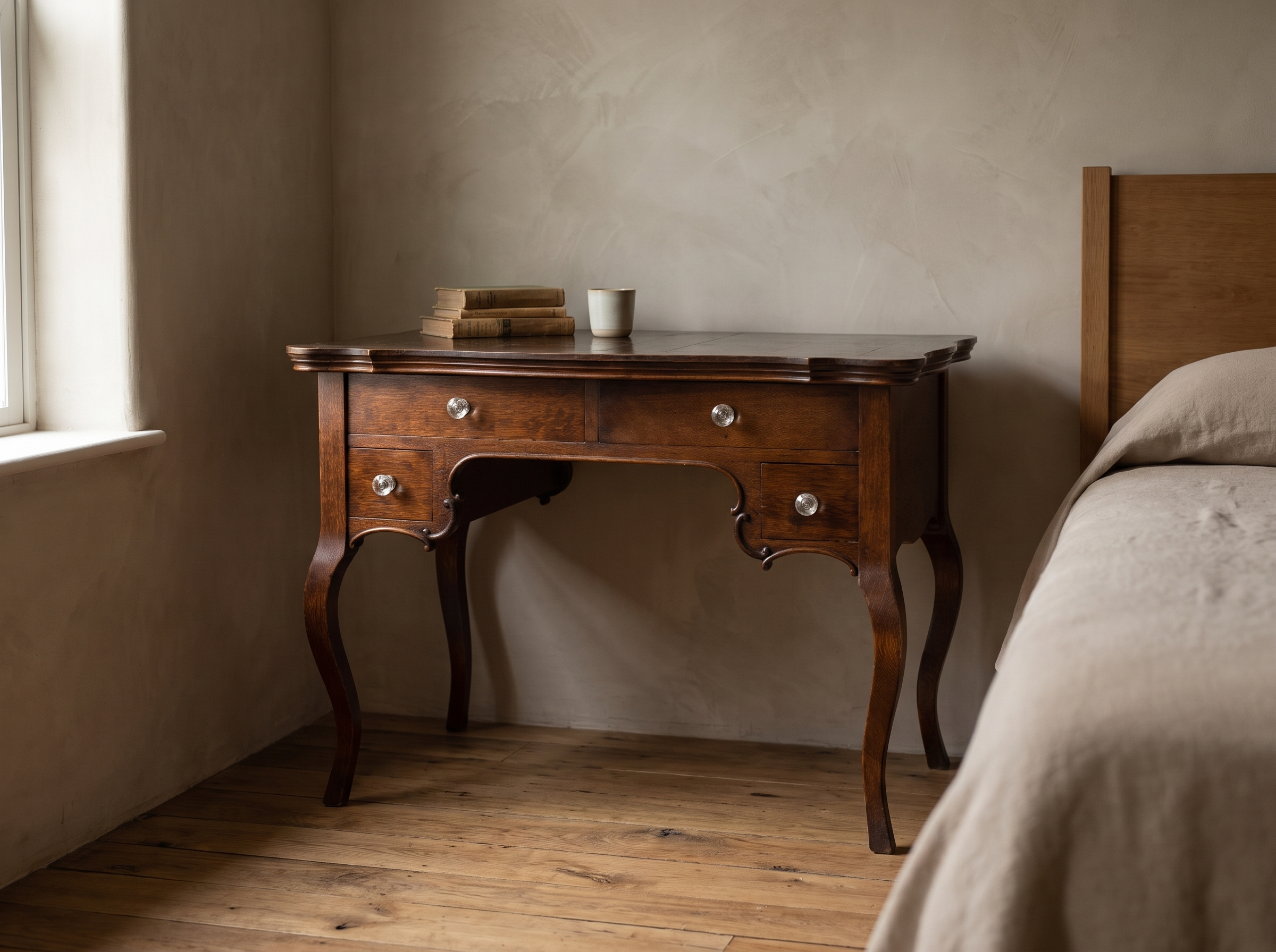 Antique writing desk staged in a bedroom writing nook