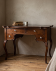 Antique writing desk staged in a bedroom writing nook